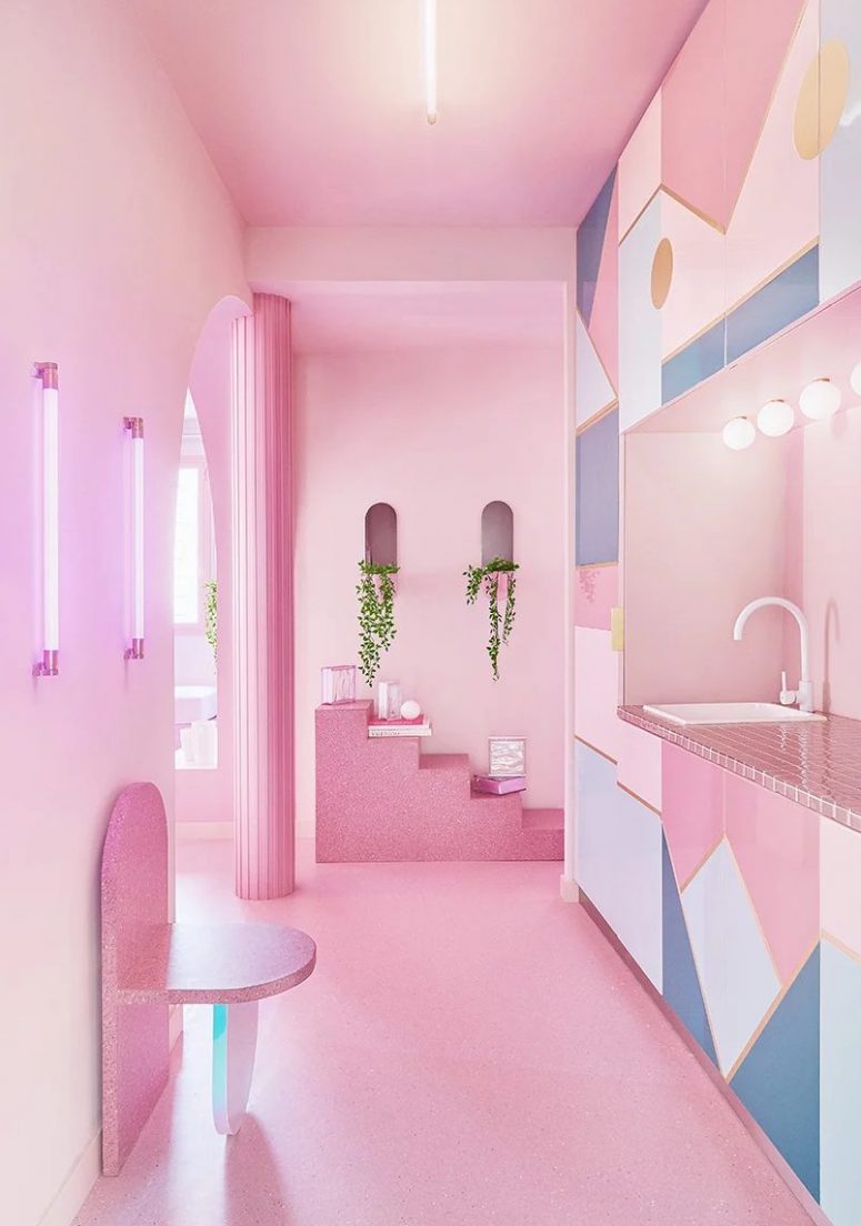 The kitchen is done with white, blue and pink, with pink tiles, catchy geometric prints and some stone furniture that rocks