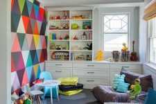05 an ultimate playroom with a colorful statement wall, a neutral storage unit, some comfy chairs is very cool