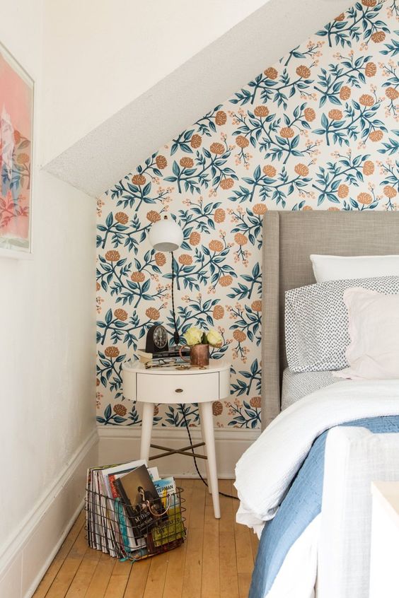 lovely modern floral wallpaper to highlight the headboard wall in a neutral and pastel bedroom