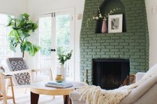09 a fireplace with a green brick surround brings color to this neutral space and makes it catchier and more interesting