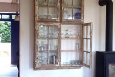 09 a shabby chic cabinet with old window frames as doors is a stylish idea for both indoors and outdoors and will fit a vintage space, too