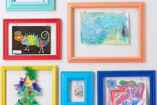 12 a colorful gallery wall with kids’ artworks placed into colorful frames is a bold decor idea to rock