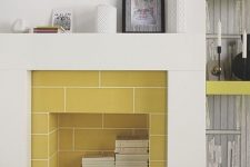 14 mustard tiles inside the fireplace and a neutral surround create a bold contrast that strikes and makes the space catchier