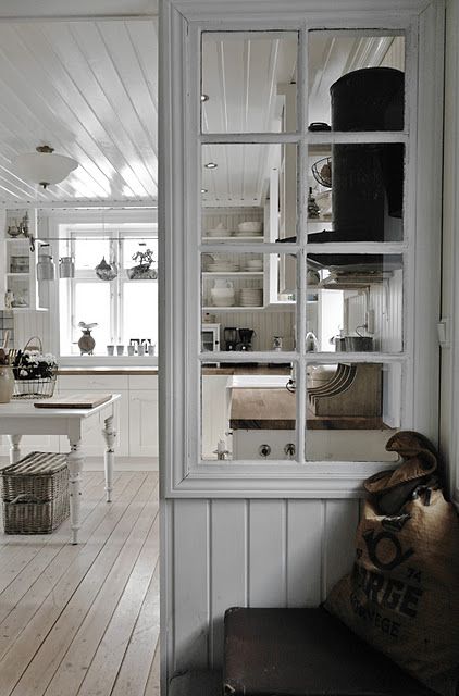 a space divider made of some wood and an old window frame is a stylish idea to go for