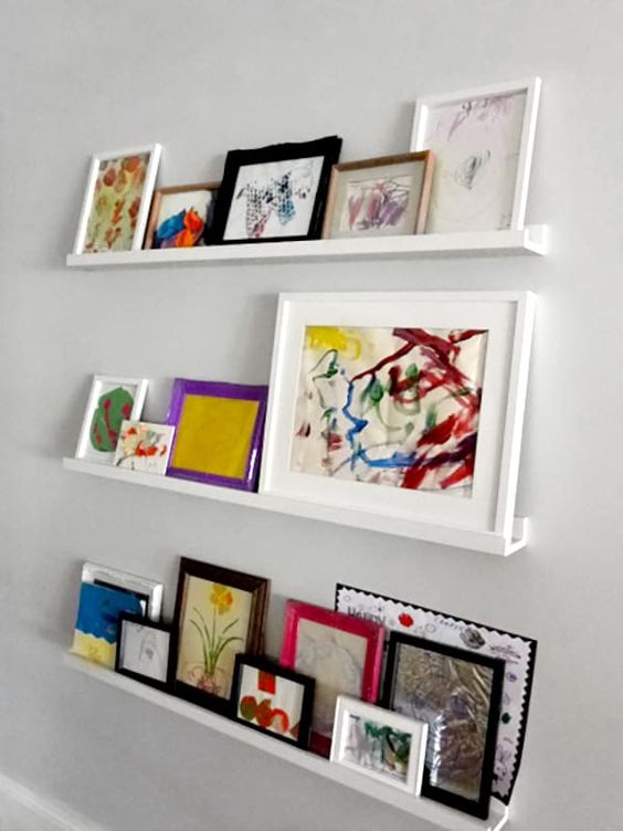 Modern white ledges like these ones will show off your kids' artworks at their best   in frames or without any