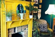 19 a brick fireplace with a sunny yellow surround, lots of plants and candles is a very cozy idea and a fresh take on a traditional fireplace