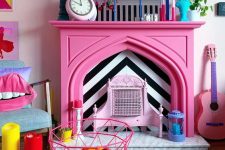 21 a quirky colorful living room finished off with a hot pink faux fireplace with colorful accessories on the mantel