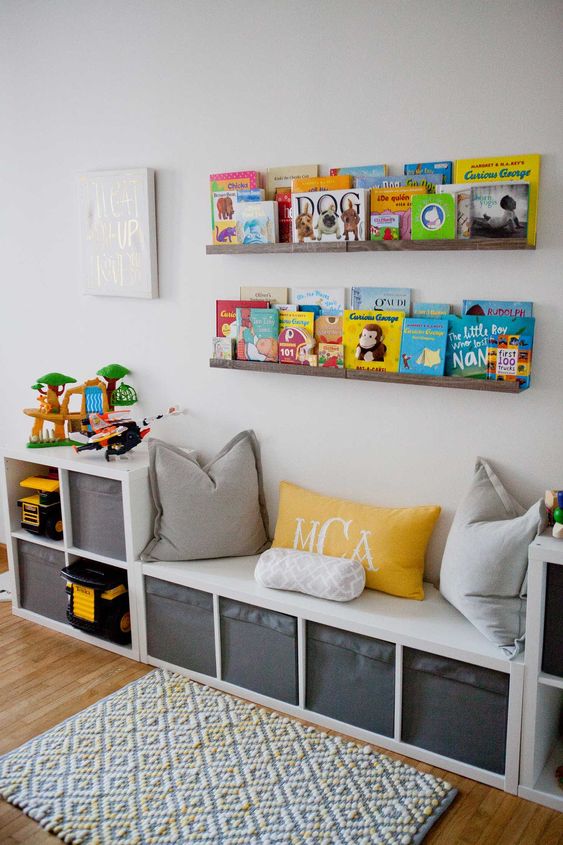 a stylish reading nook with a comfy bench and pillows and wooden ledges on the wall to display the books