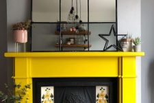 22 a vintage fireplace with floral tiles on each side and a sunny yellow mantel looks very refined and vintage-inspired