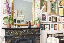 23 a refined black, white and gold fireplace with a beautiful and refined cover and a gorgeous vintage mirror over it