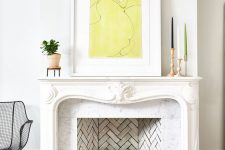 a lovely French fireplace with a plant inside