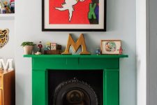 a cast iron fireplace with a bold emerald mantel to refresh its look and make it more modern