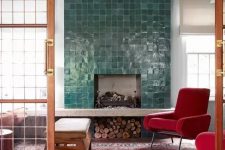 a faux fireplace with glazed green tiles around it and firewood storage under it for a chic look