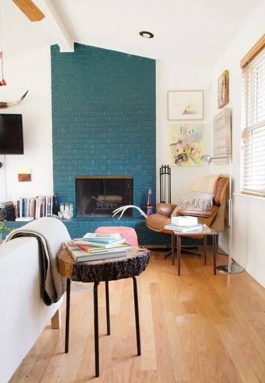 A teal brick fireplace, even a non working one, is a very non traditional decor feature to go for