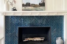 a lovely herringbone tiled fireplace