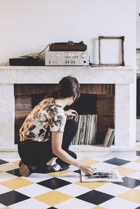 store your vinyl in a non-working fireplace - this is a very creative idea and a mantel can be used here, too