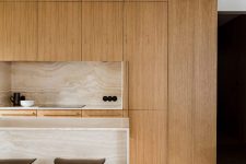 04 The kitchen cabietry is made of oak and you may see a travetine marble island and backsplashes for a luxurious and beautiful accent