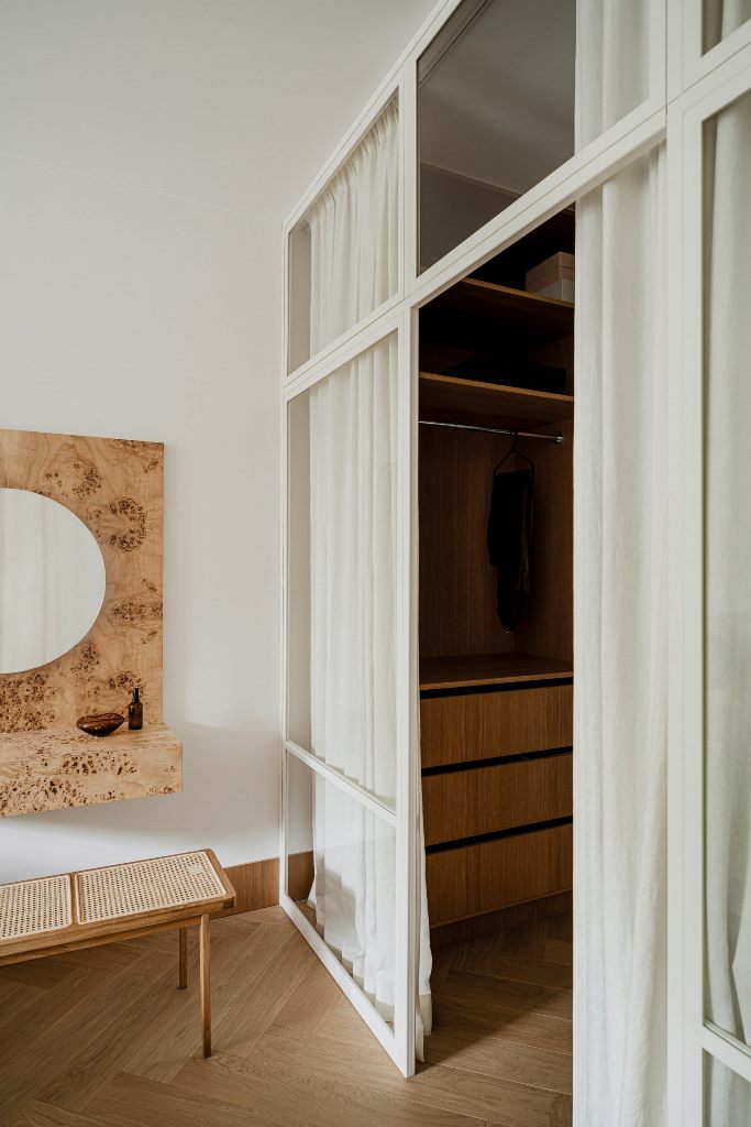 Burl wood has been used to make a distinctive vanity desk in the bedroom