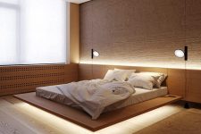 05 The master bedroom is super laconic, with a floating bed with built-in lights and some rugs