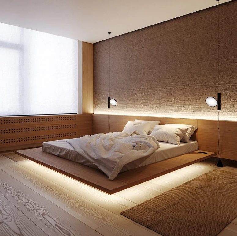 The master bedroom is super laconic, with a floating bed with built-in lights and some rugs