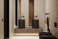 06 The bathroom is clad with catchy printed tiles and features black appliances