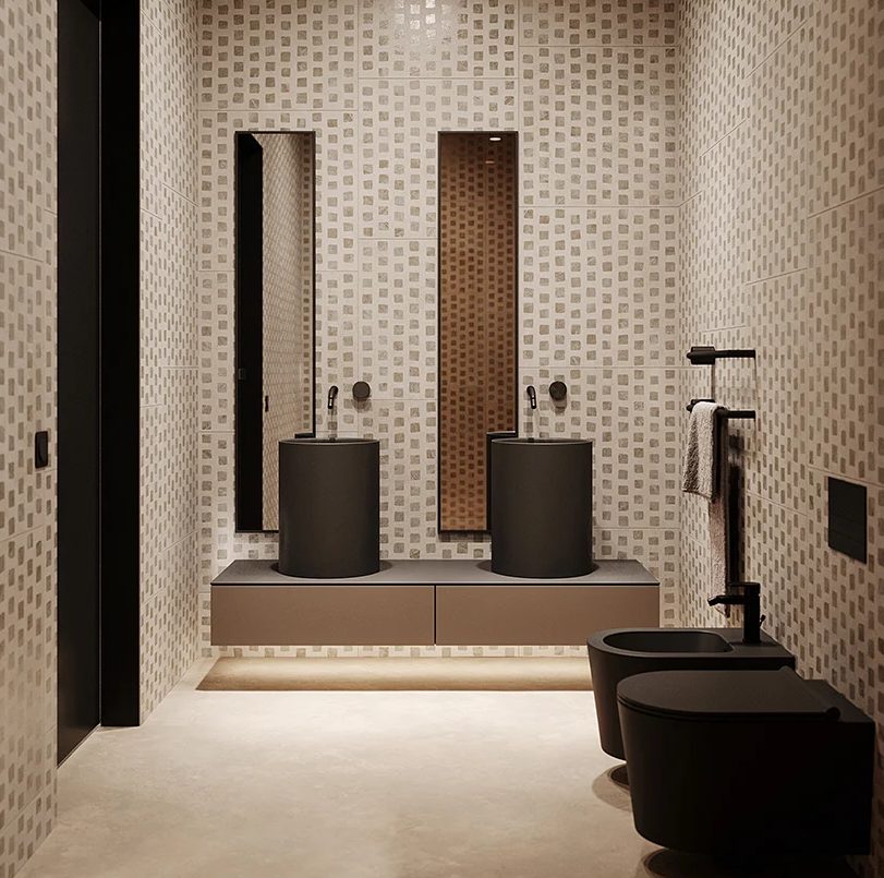 The bathroom is clad with catchy printed tiles and features black appliances
