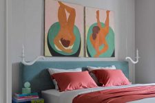 08 The bedroom shows off a grey upholstered bed, colorful nightstands and bold artworks