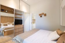08 The bedroom shows off much hidden storage space, a comfy bed and some lights – who needs more in such a space