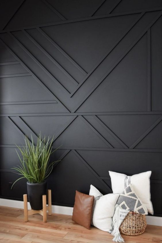 A black geometric paneled wall is a cool solution for a boho, mid century modern and just elegant contemporary space
