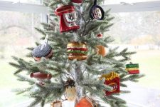 a creative and very fun tabletop Christmas tree decorated with faux food and applainces is a fantastic and hilarious idea for your kitchen