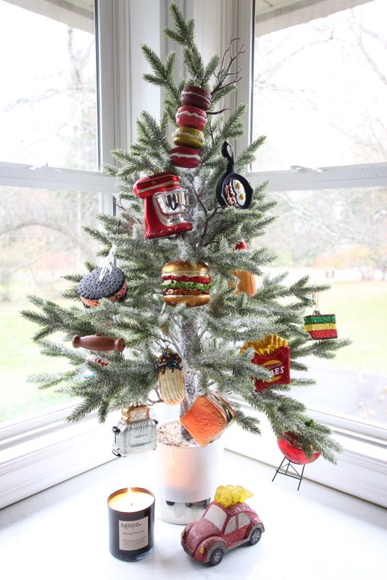 a creative and very fun tabletop Christmas tree decorated with faux food and applainces is a fantastic and hilarious idea for your kitchen