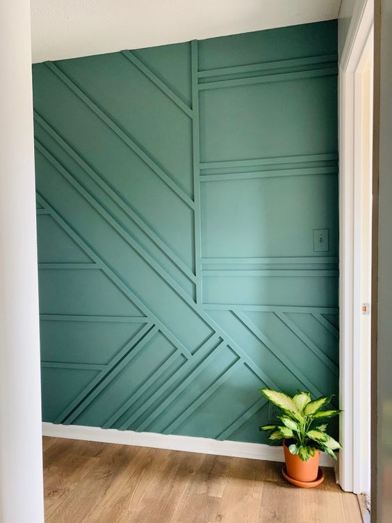 a green geometric wall is a creative option of modern wainscoting and it will add both pattern and color to the space
