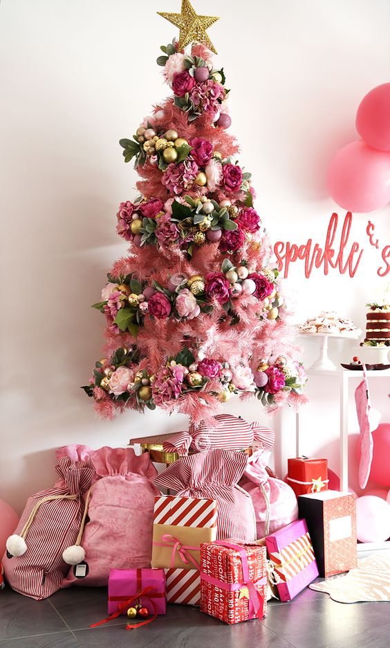 a bold christmas tree with lots of pink decor