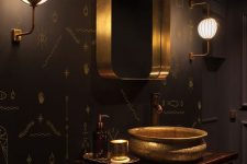 a luxorious bathroom with black walls
