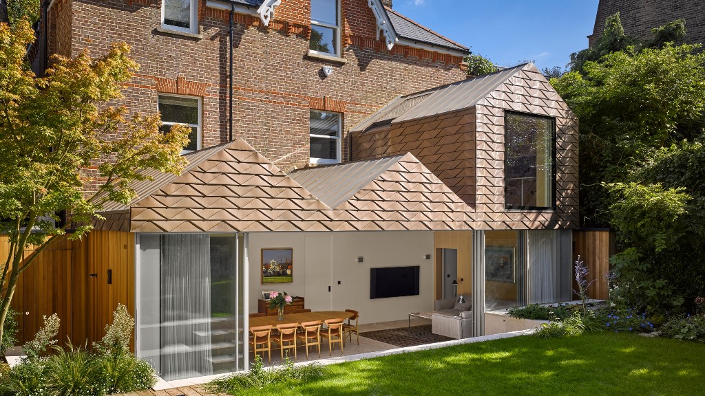 This contemporary house extension features gabled roofs and zigzags highlighting them on the facade