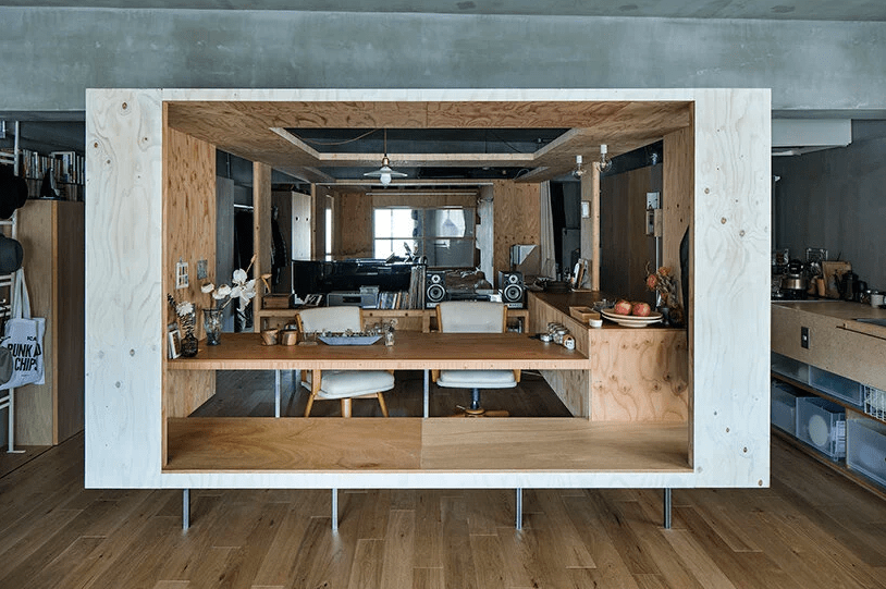 The cube contains a dining space, a part of the kitchen and a small salon