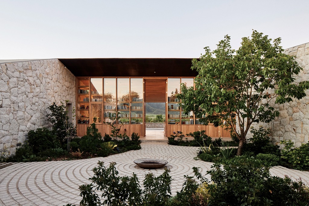 04 Glass walls allow views from the courtyard to the mountains