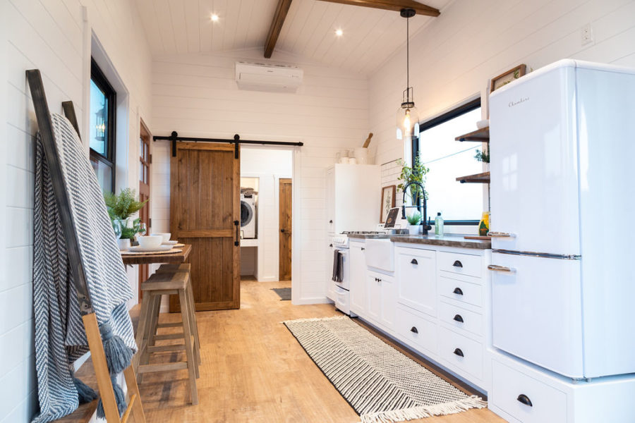 The kitchen is well equipped and has generous storage as well as a farmhouse sink