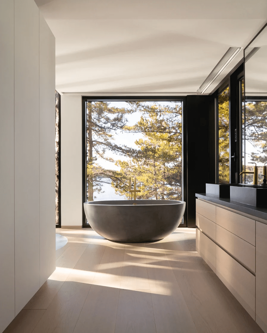 11 The minimalist bathroom features several windows to have amazign views of the lake