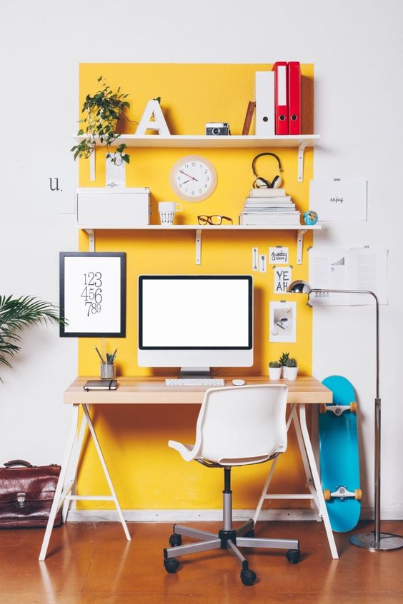 18 a home office nook highlighted with bright yellow paint that raises the mood and helps to wake up
