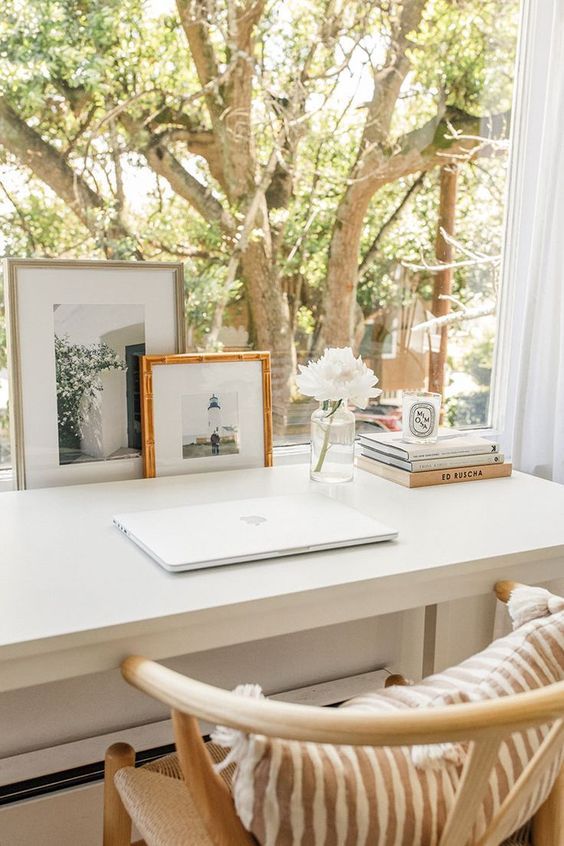 personalize your work space with some photos and blooms if you want