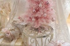 a blush Christmas tree with blush and pink ornaments is a cool idea for any vintage glam space