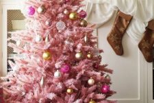 a pastel pink Christmas tree with sheer, gold and pink ornaments with a vintage feel looks very sophisticated