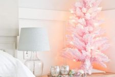 a pink tabletop Christmas tree with lights will add a little bit of glam and fun to your bedroom or some other room