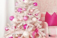 a white Christmas tree decorated with pearly, light and hot pink ornaments and some rainbows is a amazing for the holidays