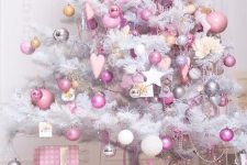 a white Christmas tree with white, light pink, mauve and hot pink ornaments, beads, silver touches is pure glam and chic