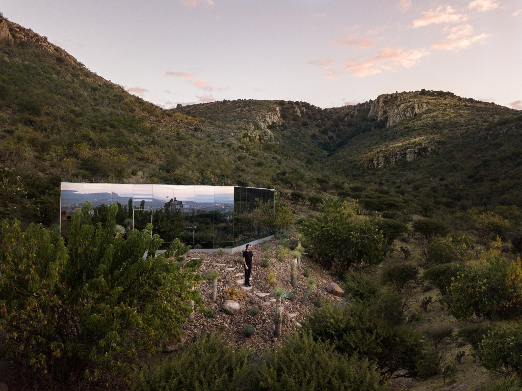 01 This unique off-grid cabin on the slopes of a volcano is clad with mirrors to reflect the landscape