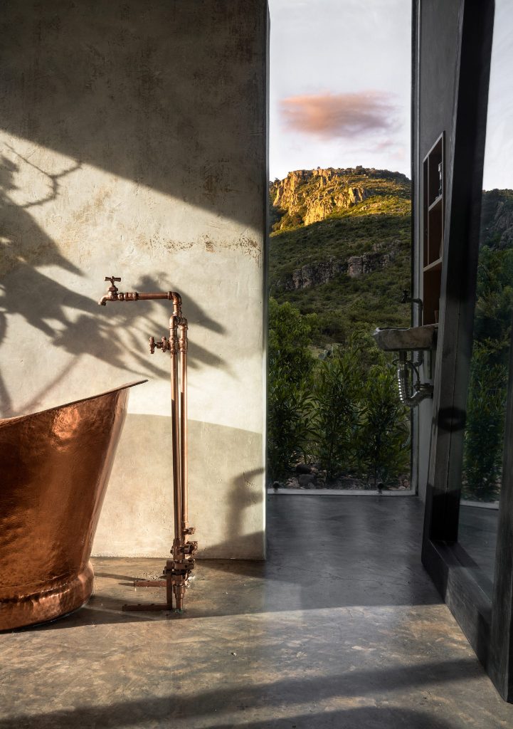 The bathroom area is fringed by floor-to-ceiling windows to get maximum of the views around