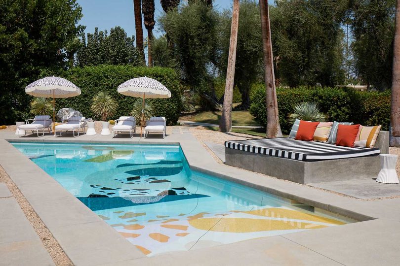 a gorgeous pool design with terrazzo floor