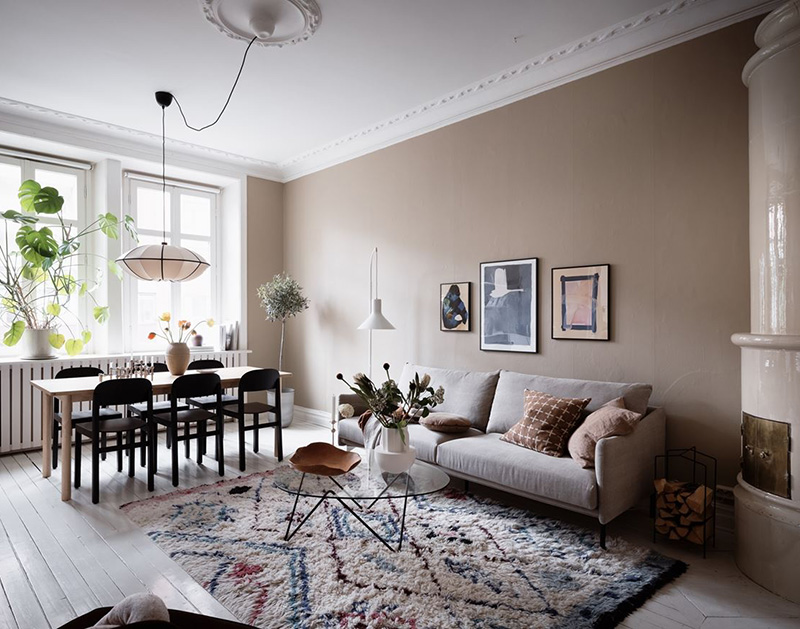 This stylish and welcoming Scandinavian apartment was done in beige and grey shades, with eclectic furniture